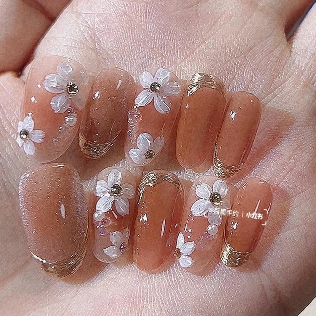 Beautiful nude manicure. Short square nails. Nail design. Manicure with gel  polish. Close-up of the hands of a young woman with a delicate nude  manicure on her nails. Elegant nails with gel